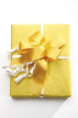 Gift box with a yellow ribbon
