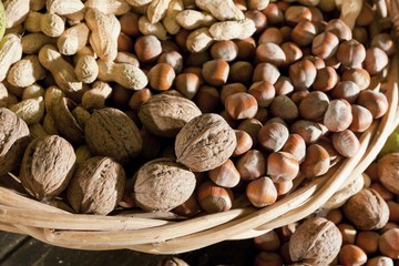 Wicker basket with mixed nuts, Walnuts (Juglans regia), Peanuts (Arachis hypogaea) and Hazelnuts (Corylus avellana)