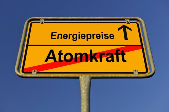 City limits sign with the words Energiepreise and Atomkraft, German for energy costs and nuclear energy, symbolic image for the exit from nuclear energy resulting in rising energy costs