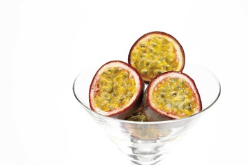 Passion fruit, halves in a glass