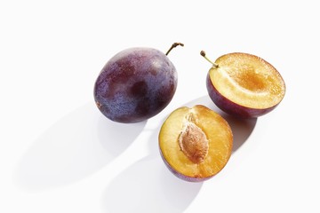 Plums, whole and halved