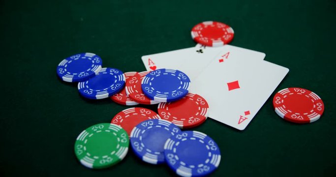 Playing cards and casino chips on poker table 