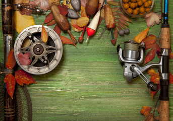 Fishing tackle on wooden background
