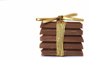 Stack of chocolate tied with ribbon in a bow