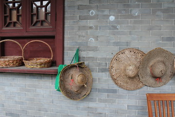 Chinese Hats and Baskets hanging in a Buddhist Temple Garden in Guangdong Canton China Asia