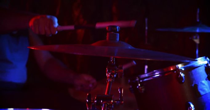 Drummer playing on drum set 