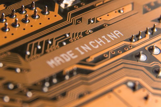 Macro image of a motherboard with the inscription "Made in China".