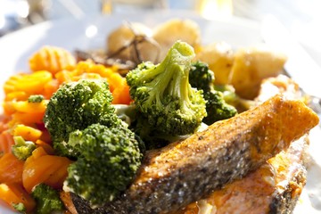 Grilled salmon with broccoli, carrots and rosemary potatoes