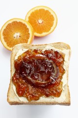 Slice of toast, toasted slice of bread, with homemade orange marmalade