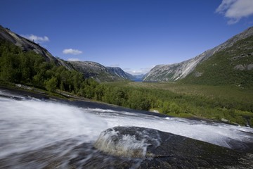 River flowing over granite rocks at Hellmobotn, Hellmofjorden, Norway, Scandinavia, Europe