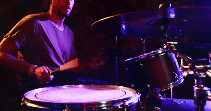 Drummer playing on drum set 