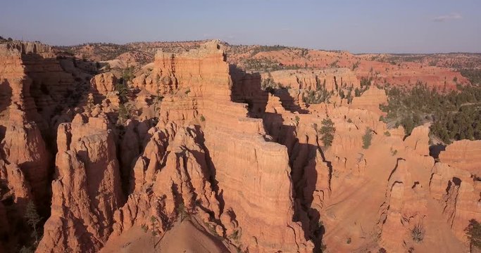 Aerial Bryce Canyon Red Canyon landscape climb forward fast. Red Canyon near Park within Dixie National Forest in southwest Utah. Geological structures called hoodoos formation weather water erosion.