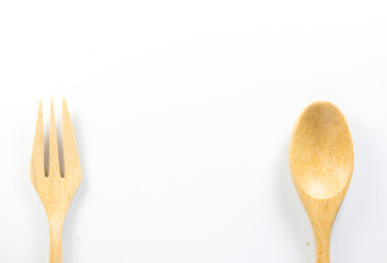 Wooden spoon and wooden fork on white background. Isolated