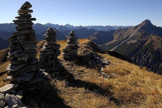 Small stone towers in front of Alpine panorama, Namlos, Lechtal, Reutte, Tyrol, Austria, Europe