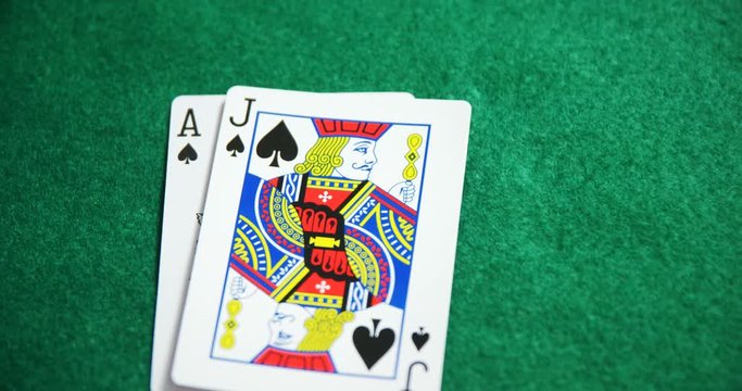 Two playing cards on poker table in casino 