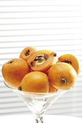 Medlars (Mespilus germanica) in a glass