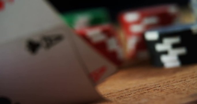 Playing cards and casino chips on poker table 