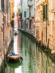 Fototapeta na wymiar Canals of Venice in the summer