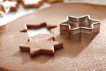 Cutting out cinnamon cookies
