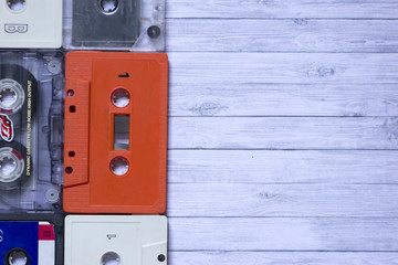 Old cassette tapes with a wooden background