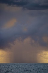 Storm, rain shower and thunderstorm over the sea