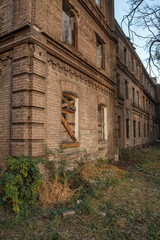 Facade of old abandoned brick building