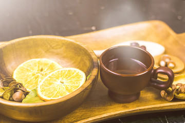 Tray with wooden utensils and spices for tea