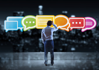 Businessman watching social network interface on a rooftop 3D rendering