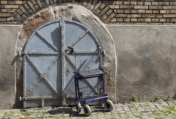 Rollator or wheeled walker in front of the basement access of a house, Germany, Europe