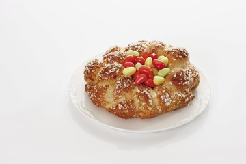 Savarin with sugar Easter eggs on a plate