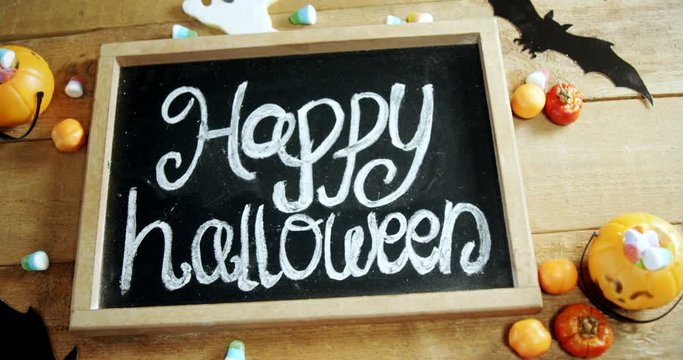 Happy halloween text written on a slate 