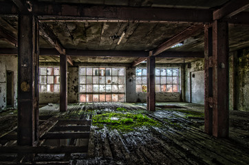 Fototapeta na wymiar Old factory with rotten wood on the floor