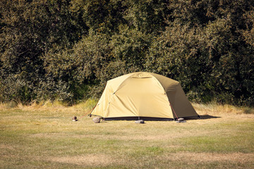 Outdoor Green Tourist Tent at a Field © dvoevnore