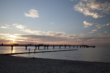 Obraz premium Sunset, pier, Baltic Sea resort town of Zingst, Mecklenburg-Western Pomerania, Germany, Europe