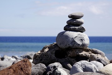 Stacked lava rocks on the beach of Playa de Santiago, La Gomera, Canary Islands, Spain, Europe