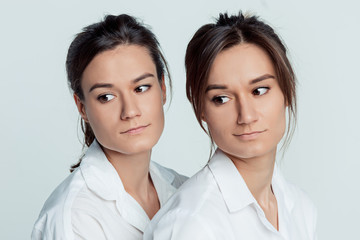 Studio portrait of female twins