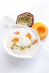 Porcelain bowl with yogurt, passionfruit and apricot