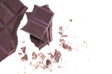 bar of chopped chocolate isolated on white