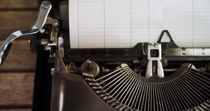 Vintage typewriter on wooden table 