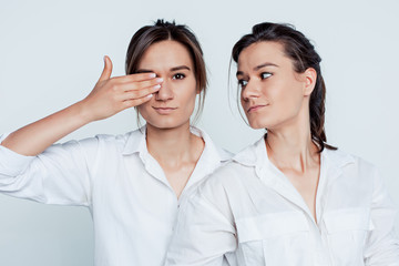 Studio portrait of female twins