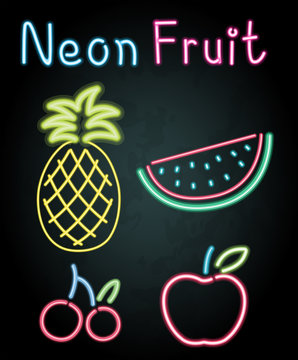 Neon fruits on black background
