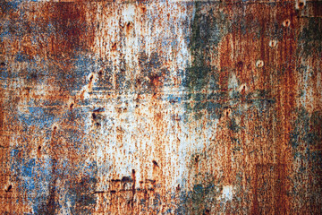 Rusty metal plate with shabby paint, iron texture background