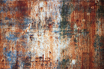 Rusty metal plate with shabby paint, iron texture background