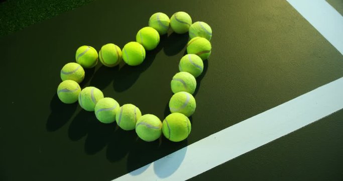Tennis balls arranged in heart shape 