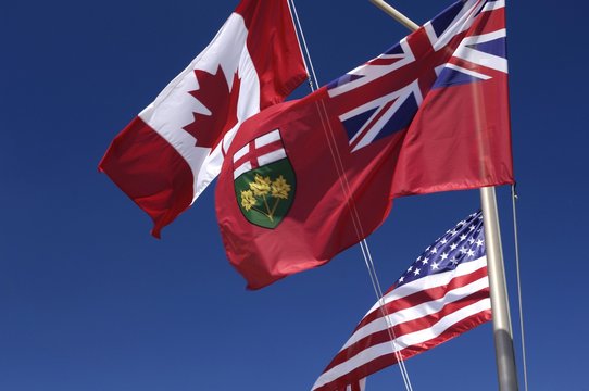 Flags of Ontario, Canada and United States flying in the wind