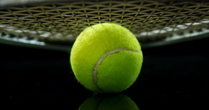 Tennis ball and racket in studio 