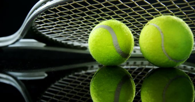 Tennis balls and racket in studio 