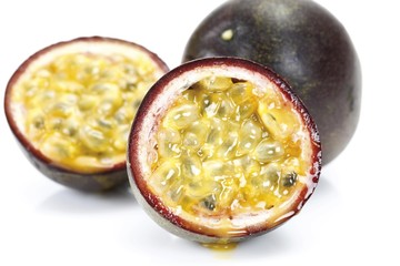 Two passion fruits and a halved one