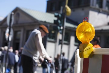 Safety barrier with a barricade lamp at a pedestrian crossing in Berlin Mitte, Germany, Europe