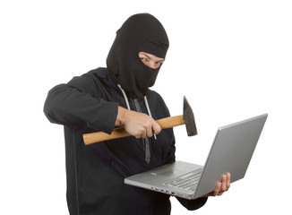 Criminal Woman Hacker Wearing Hood On in Black Clothes and Balaclava Destroy  Laptop with Hammer
